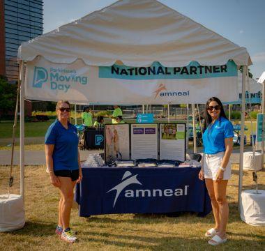 Parkinson's Foundation tent with volunteers at a Moving Day event