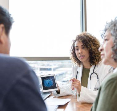 Doctor going over brain scan with patients