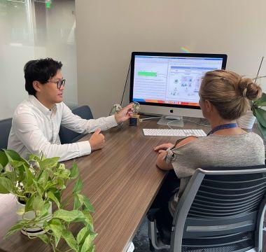 Hikaru Kamo showing data on computer