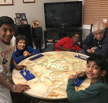 Veera's parents, husband and two sons playing cards together
