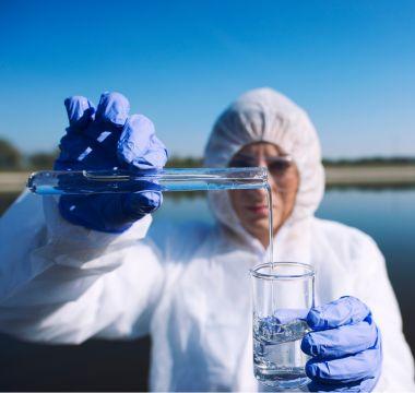 Researcher studying a sample of water