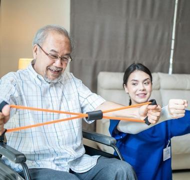 Man doing PT exercises with a nurse