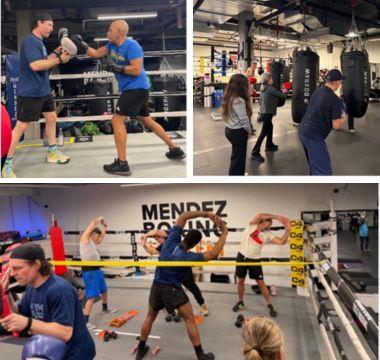 People exercising at a boxing gym