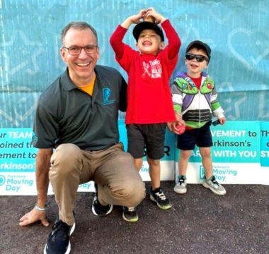 John with family at a Moving Day event