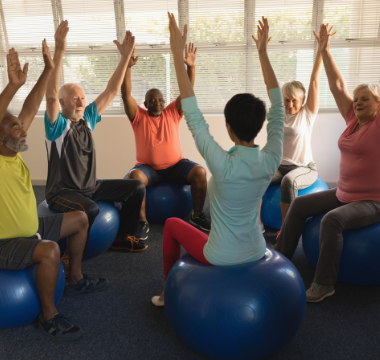 Exercise class sitting on stability balls
