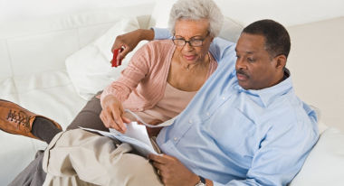 Couple reading together in bed