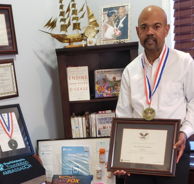 Richard holding his award 