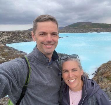 Scott Warren standing with woman by a large body of water