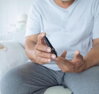 Man testing his sugar levels for diabetes