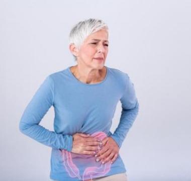 Woman clutching her stomach in pain