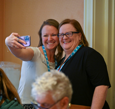 2 women taking a selfie at the 2025 Summit