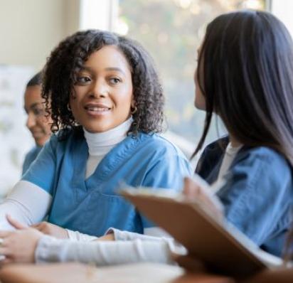 Three female nurses learning