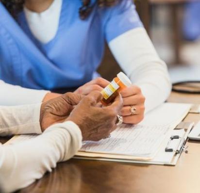 Nurse reviewing medication with patient
