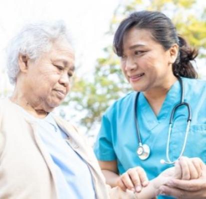 Nurse checking patient's pulse