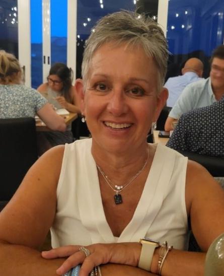 Cindy Finestone sitting at a table