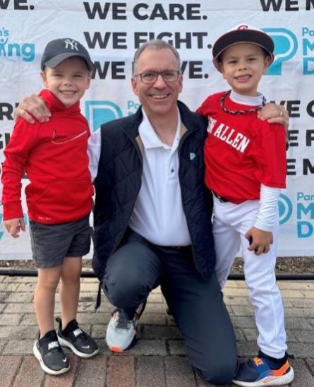 John with family at a Moving Day event