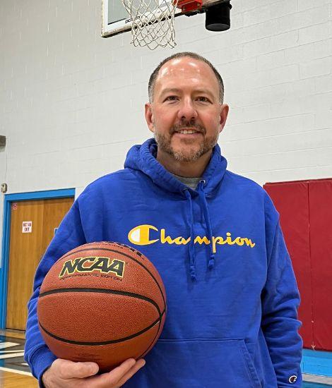 Bill McCleery holding basketball