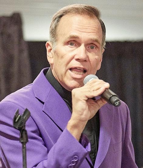 Photo of Rod Marino speaking into a microphone