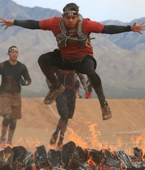 Christian Banda jumping over fire in Spartan race