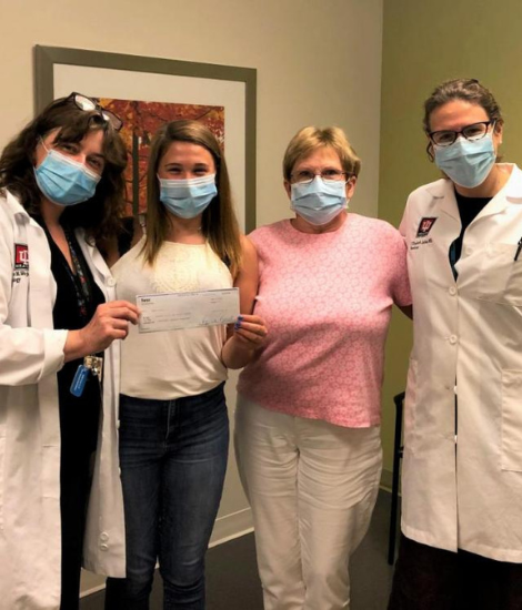 Hannah Wolf with group of doctors