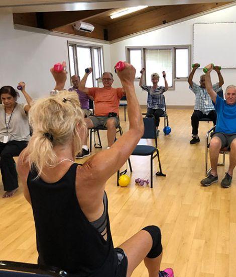 Group of people exercising at class