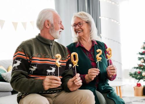 Couple holding 2-0-2-3 signs