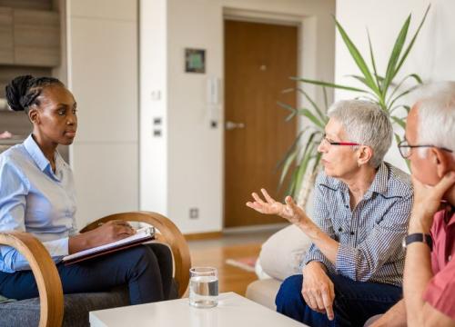 Couple sitting with a counselor