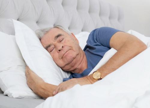 Man sleeping in bed