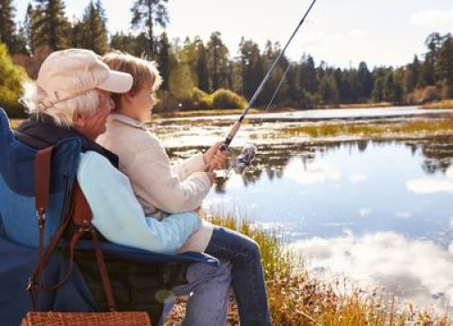 Grandpa fishing with his grandson