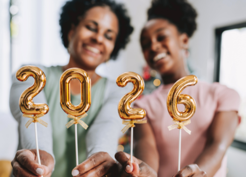 Mother and daughter hold number 2026 new year