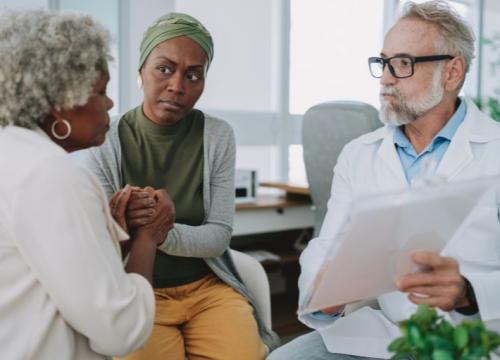 Mother and daughter meeting with doctor