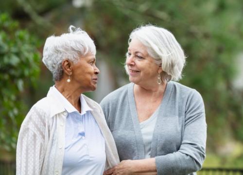 Two friends walking together, showing support