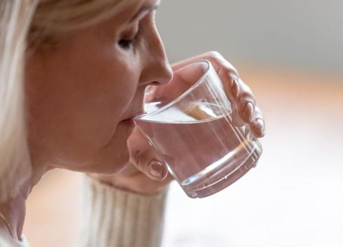 Woman drinking water from a glass