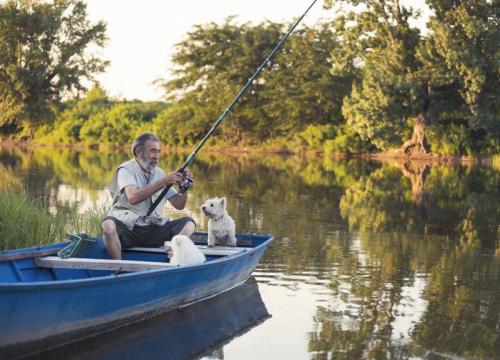 Man and his dog fishing