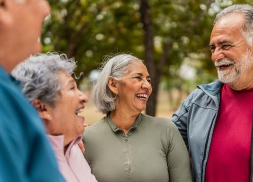 Group of senior friends laughing together outside