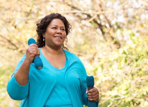 Woman exercising with weights