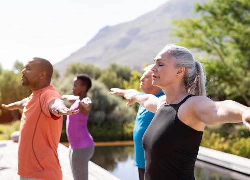 People doing yoga outside