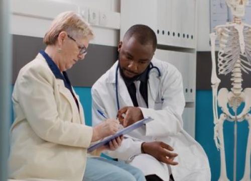 Doctor going over paperwork with patient