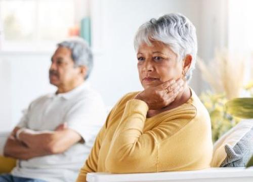 Woman thinking next to husband
