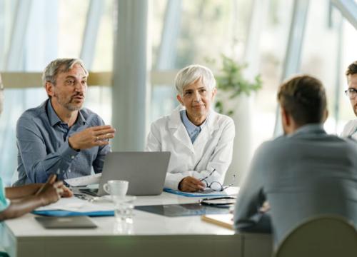 Group of doctors and leaders talking on a meeting 