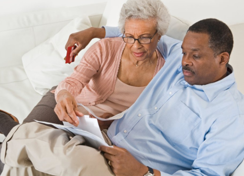 Couple reading together in bed