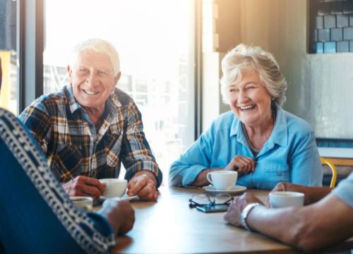 Senior friends talking over coffee