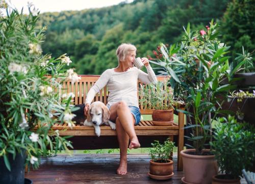 Woman sitting on a bench outside