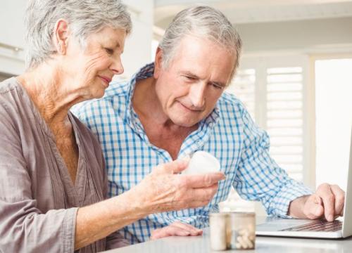 Couple reading pill medications