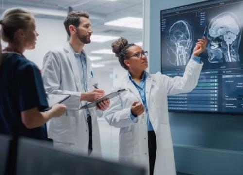 Neurologists looking at brain scans
