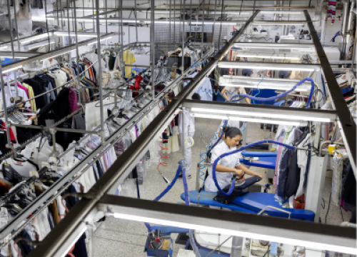 an overview shot of a dry cleaner's backroom