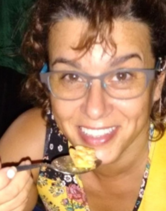 Monica Adrian Broll eating off of a spoon