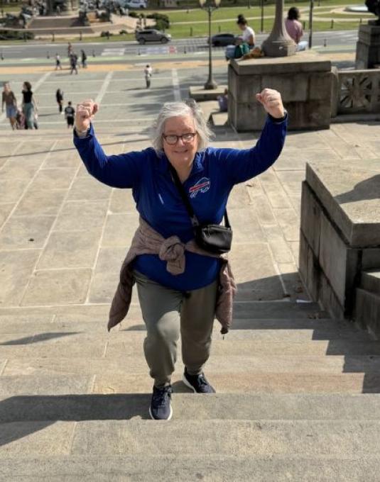Lynn Scott climbing stairs
