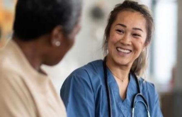 Medical professional smiling at patient