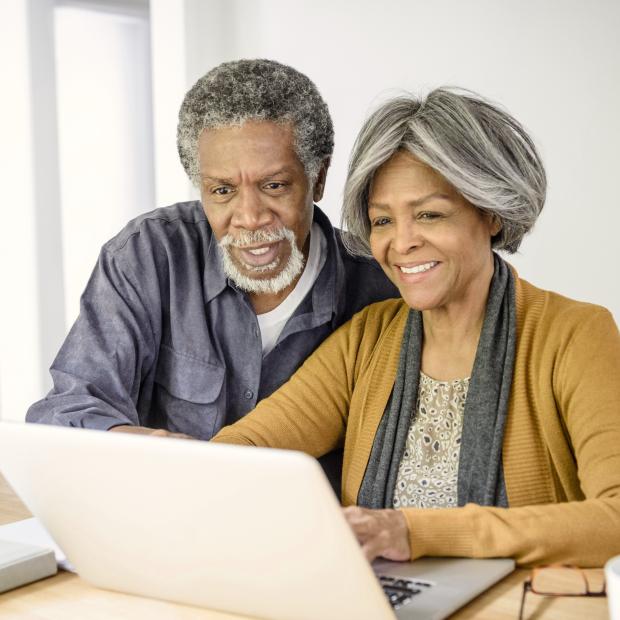 Couple looking at laptop